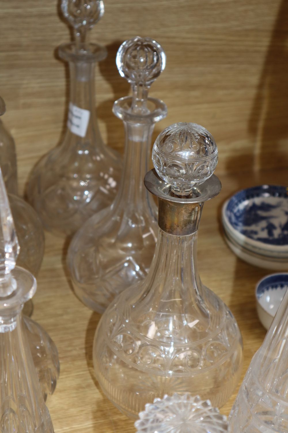 A silver collared decanter and eight other decanters, tallest 46cm incl. stopper